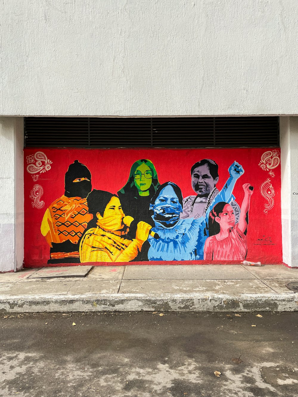a garage door with a mural of people painted on it