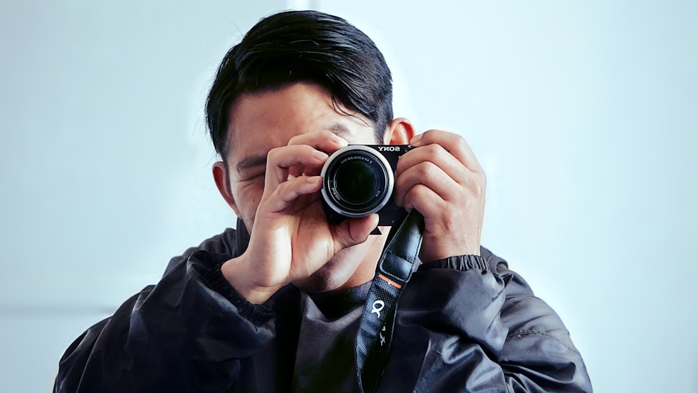a man taking a picture with a camera