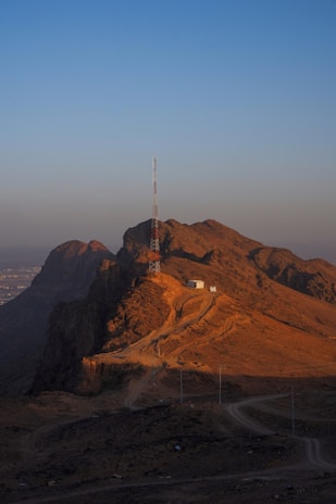 a hill with a radio tower on top of it