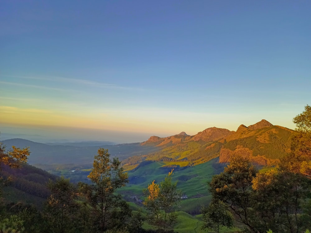 a view of a mountain range at sunset