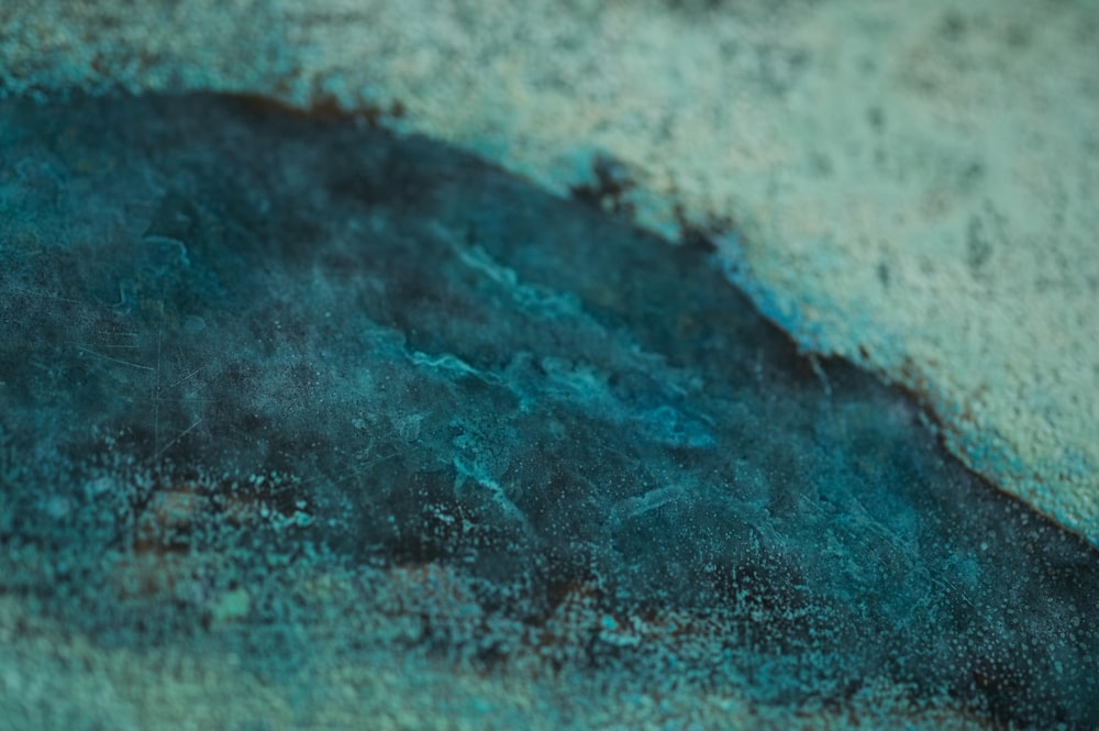 a close up of a blue and black substance