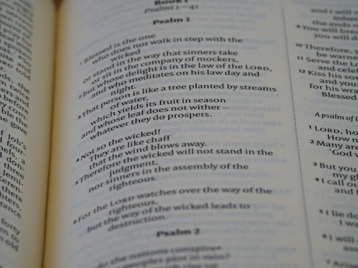 A close-up view of a printed page from a Bible, with text from Psalm 1 and Psalm 2. The text is clearly legible and the page is lit evenly, showing the structure and layout of the biblical text.