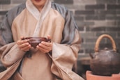 a woman holding a bowl in her hands