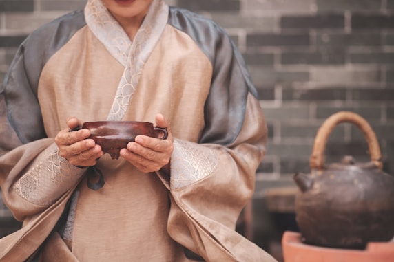 a woman holding a bowl in her hands