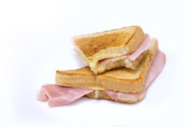 a ham and cheese sandwich cut in half