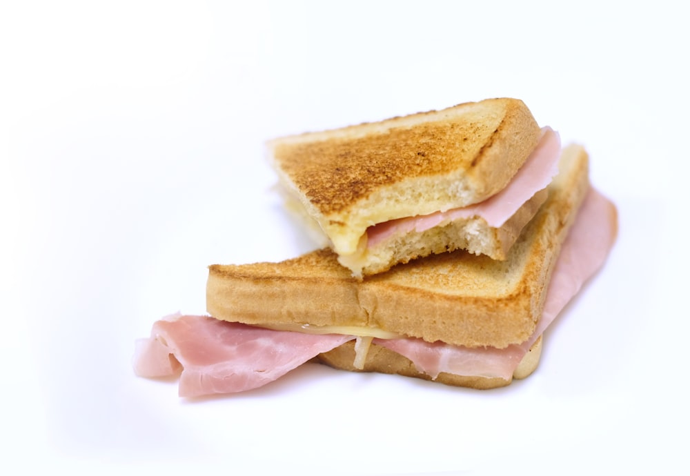 a ham and cheese sandwich cut in half