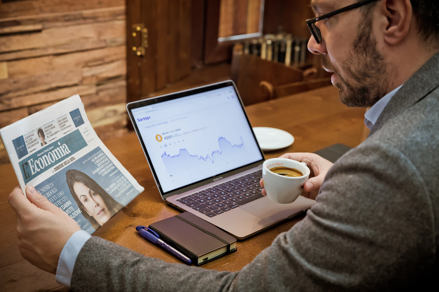 A real estate investor reviewing loan documents at a desk