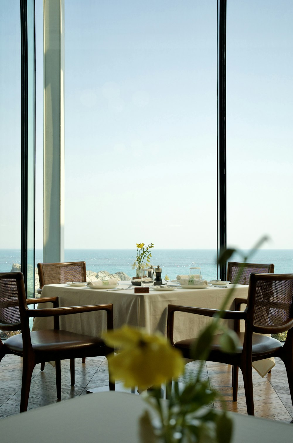 a table with a vase of flowers on top of it