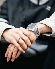 A man wearing a stylish black ring while working at a desk.