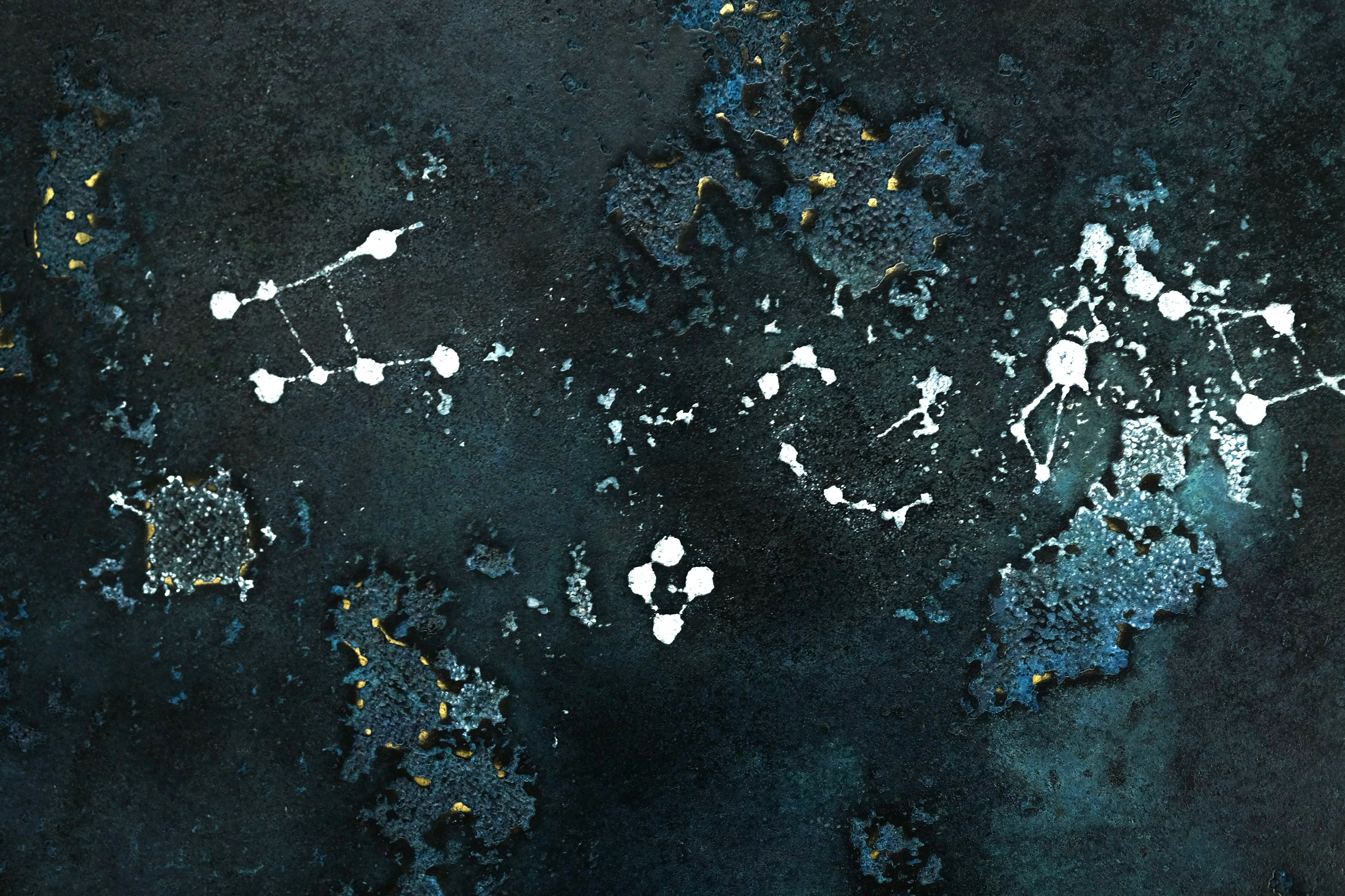 a black and white painting with white dots on it