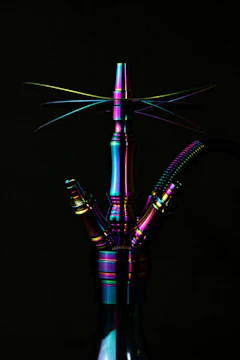 A vibrant hookah crafted from ethically sourced metals and colorful recycled glass.