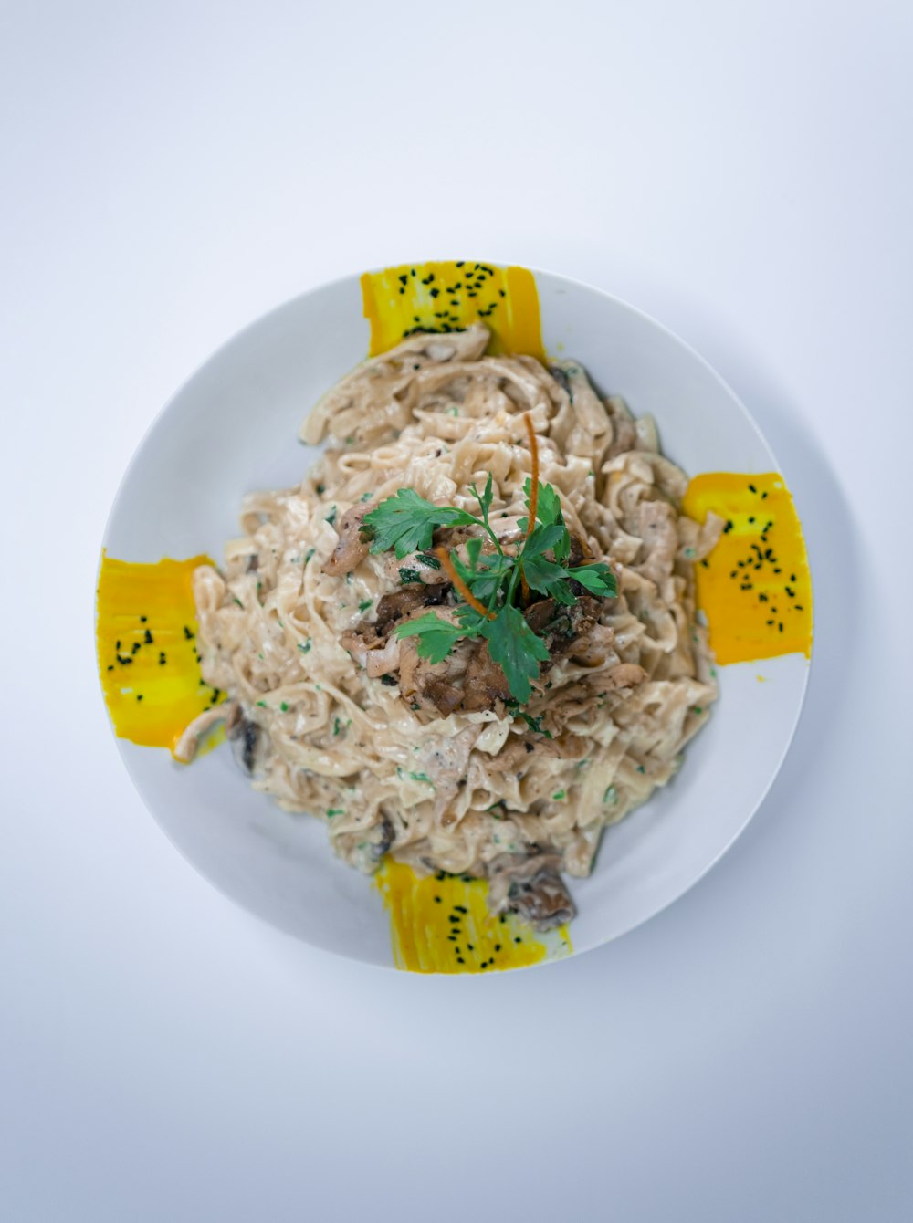 a white plate topped with pasta and cheese