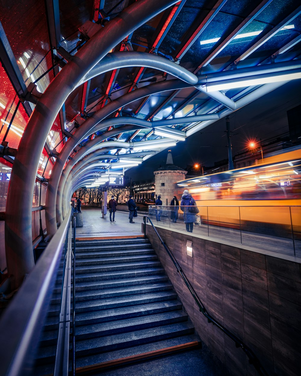 a group of people walking down a set of stairs