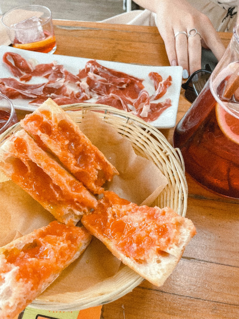 a person sitting at a table with a plate of food