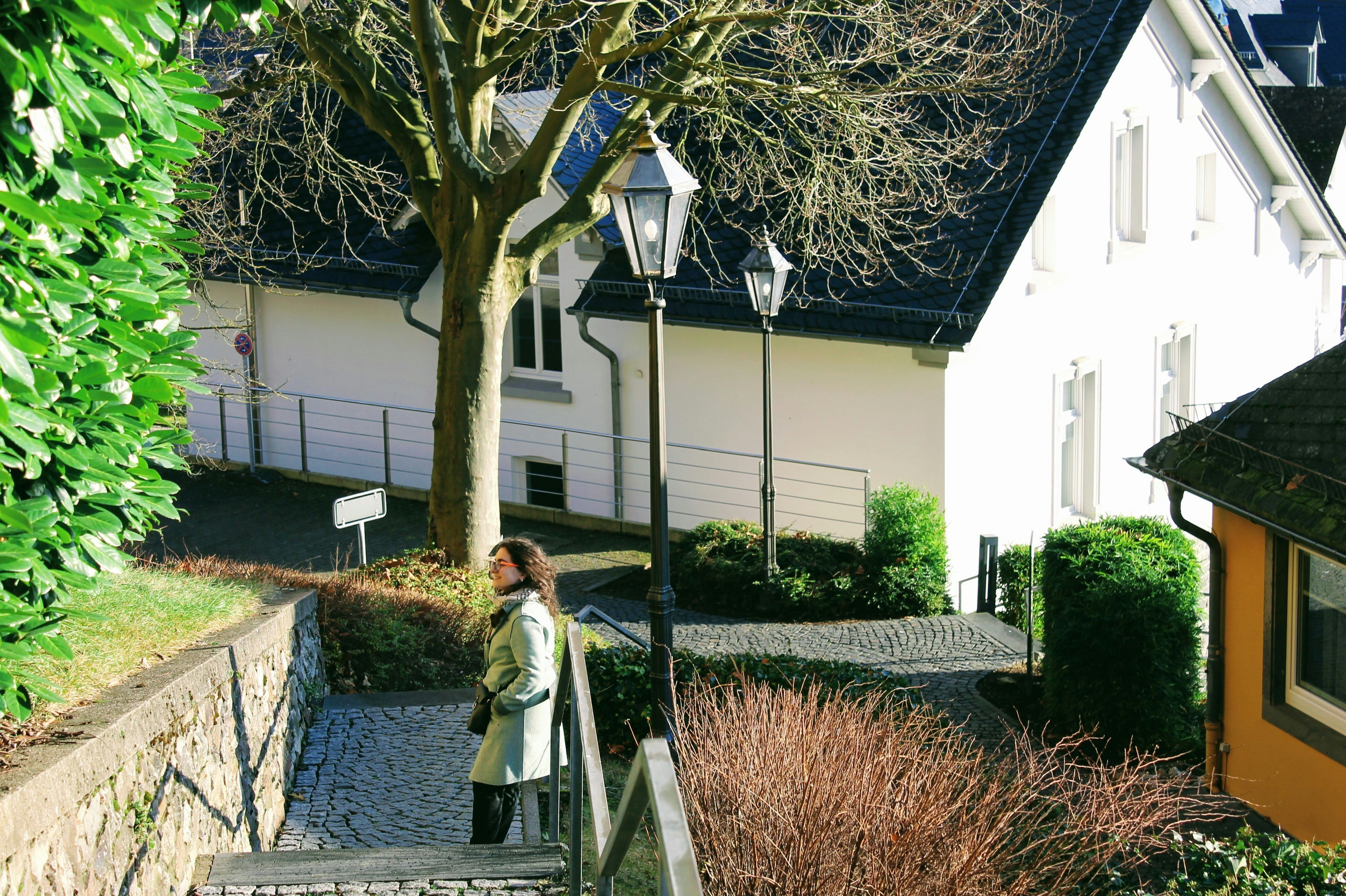 a woman walking up a set of stairs