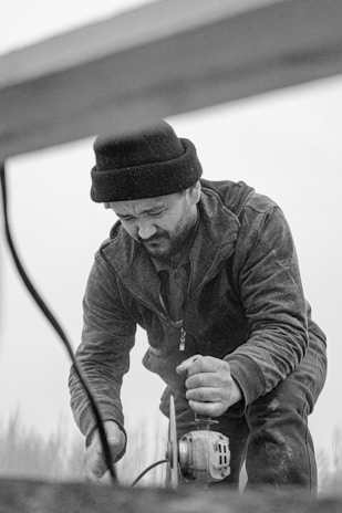 A candid photo showing Eroni engaged in his work, highlighting dedication.