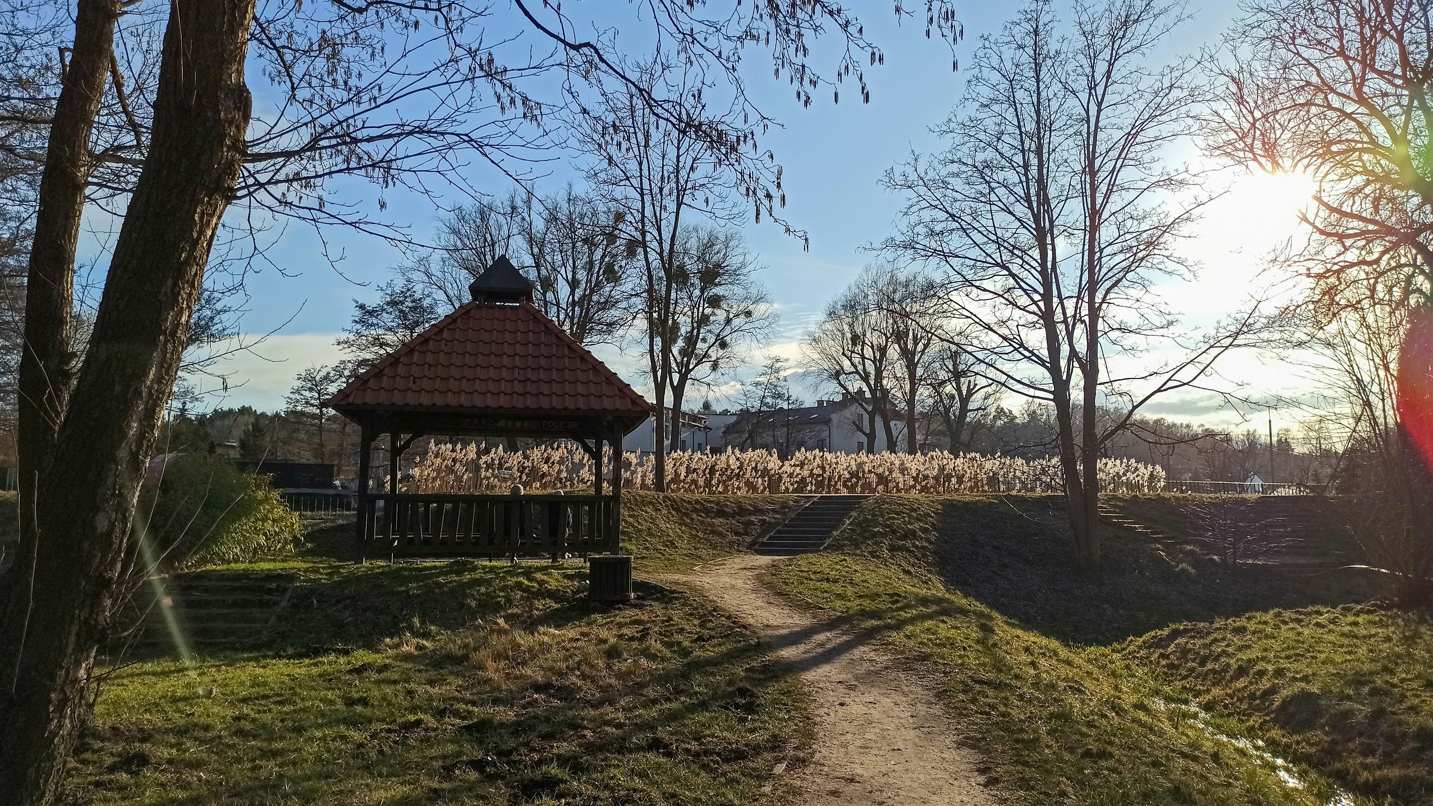 a gazebo in the middle of a grassy field