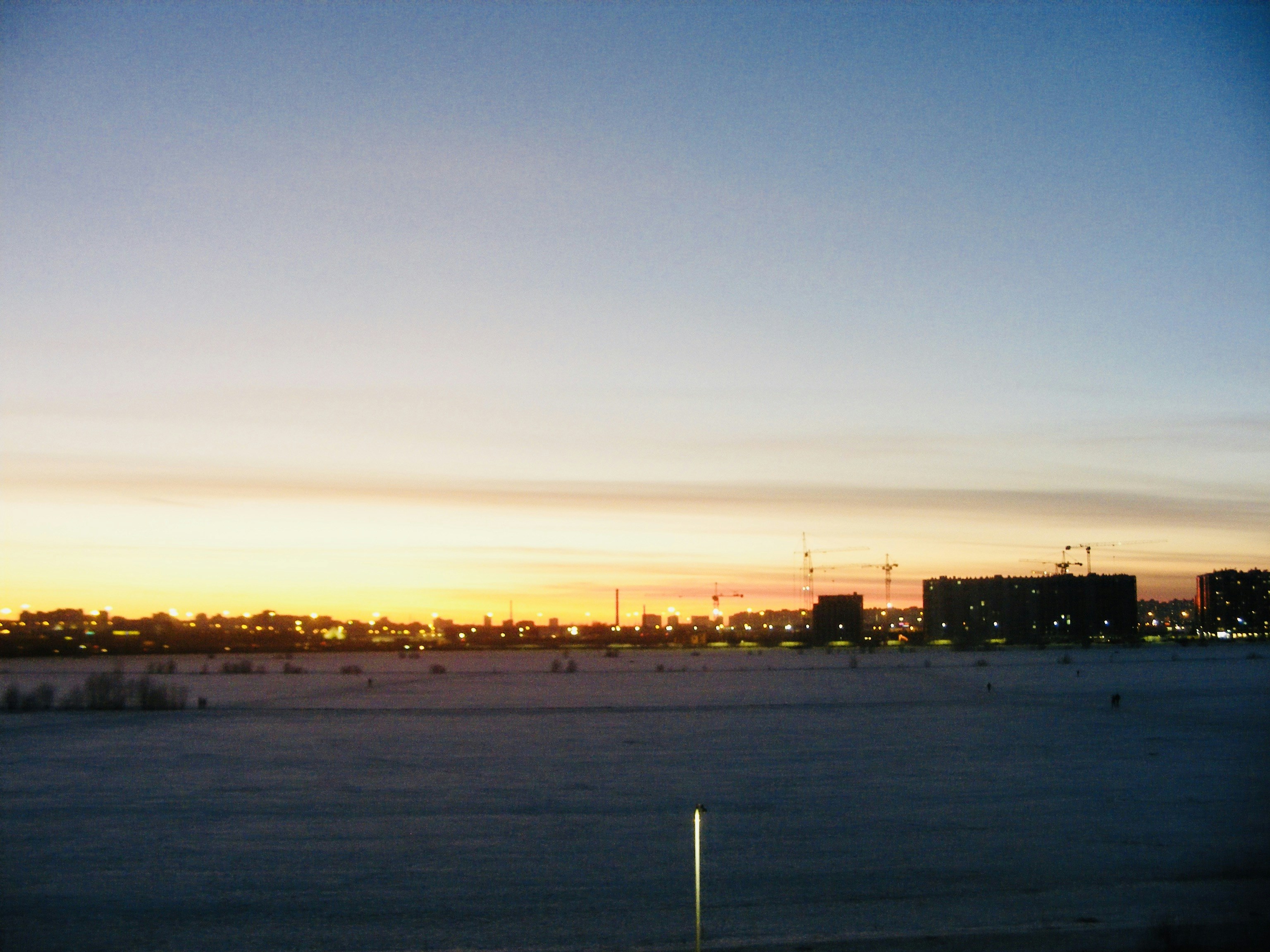 a view of a city skyline at sunset