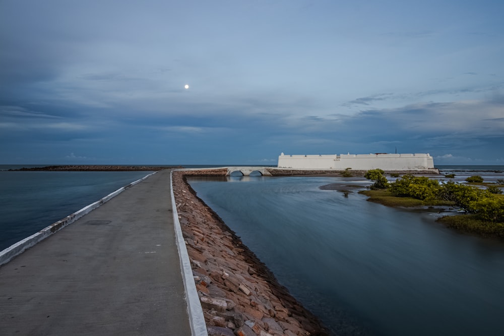 a view of a body of water with a building in the background