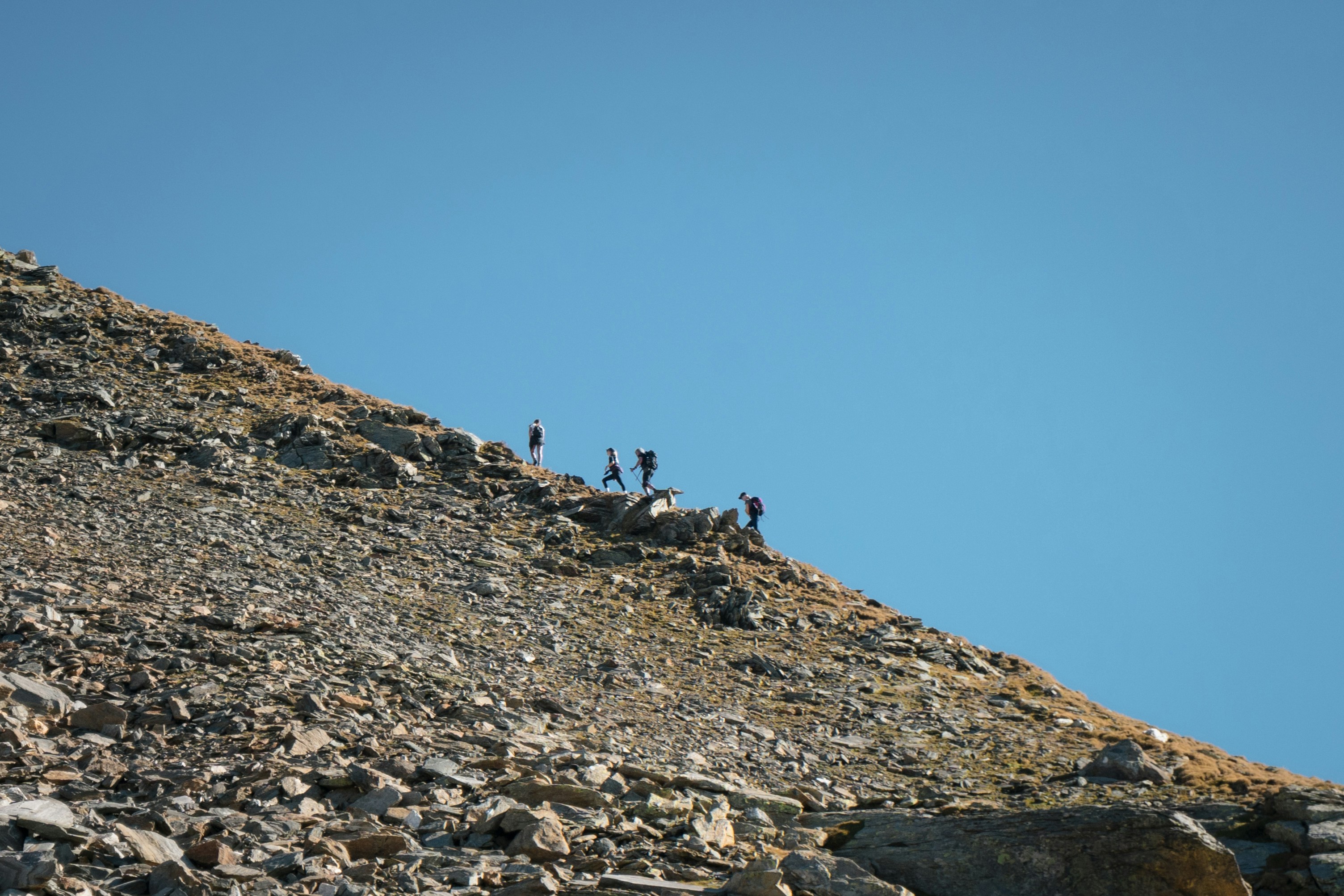 Rocky hillside with plus-size travelers