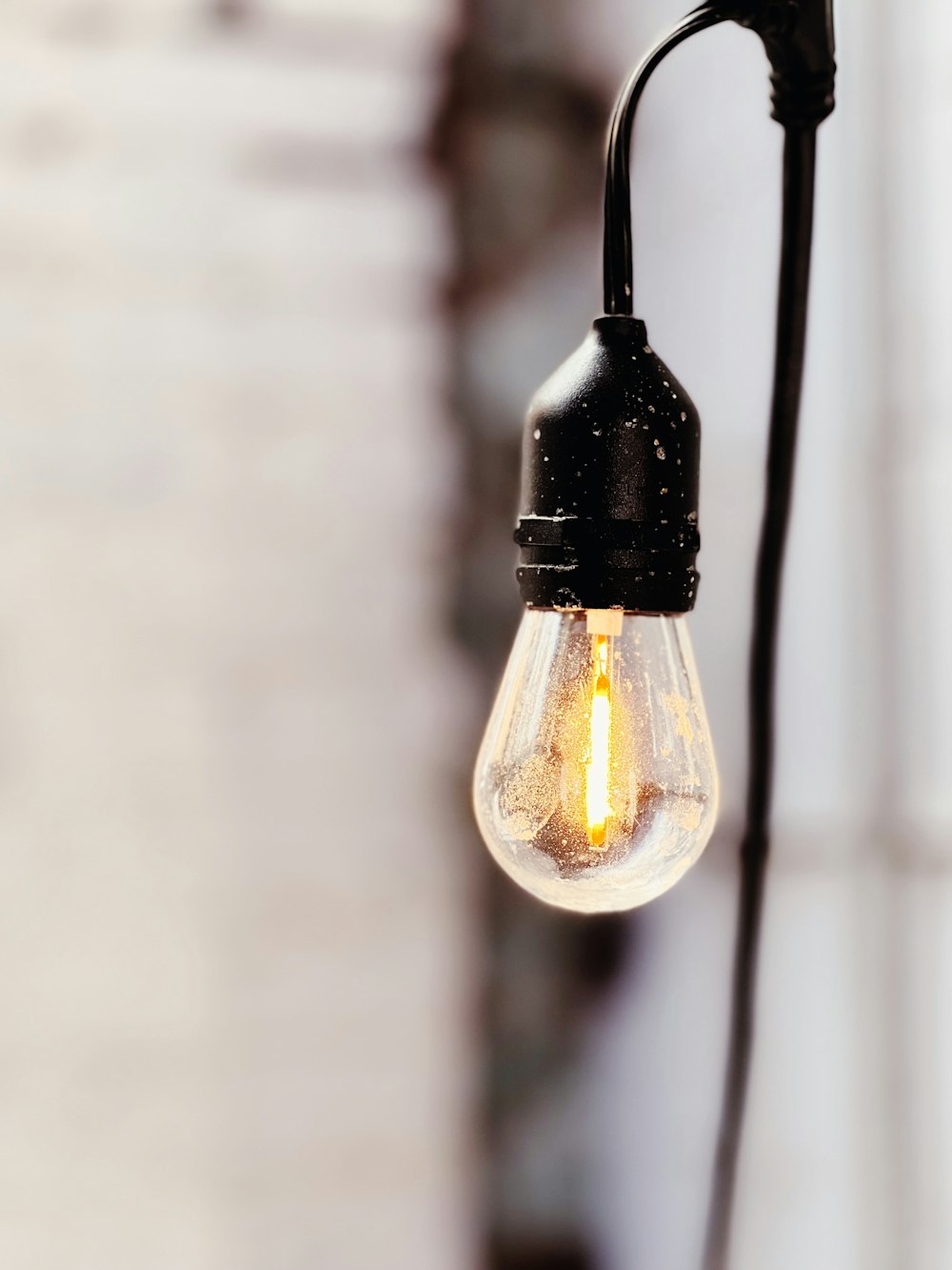a light bulb hanging from a wall