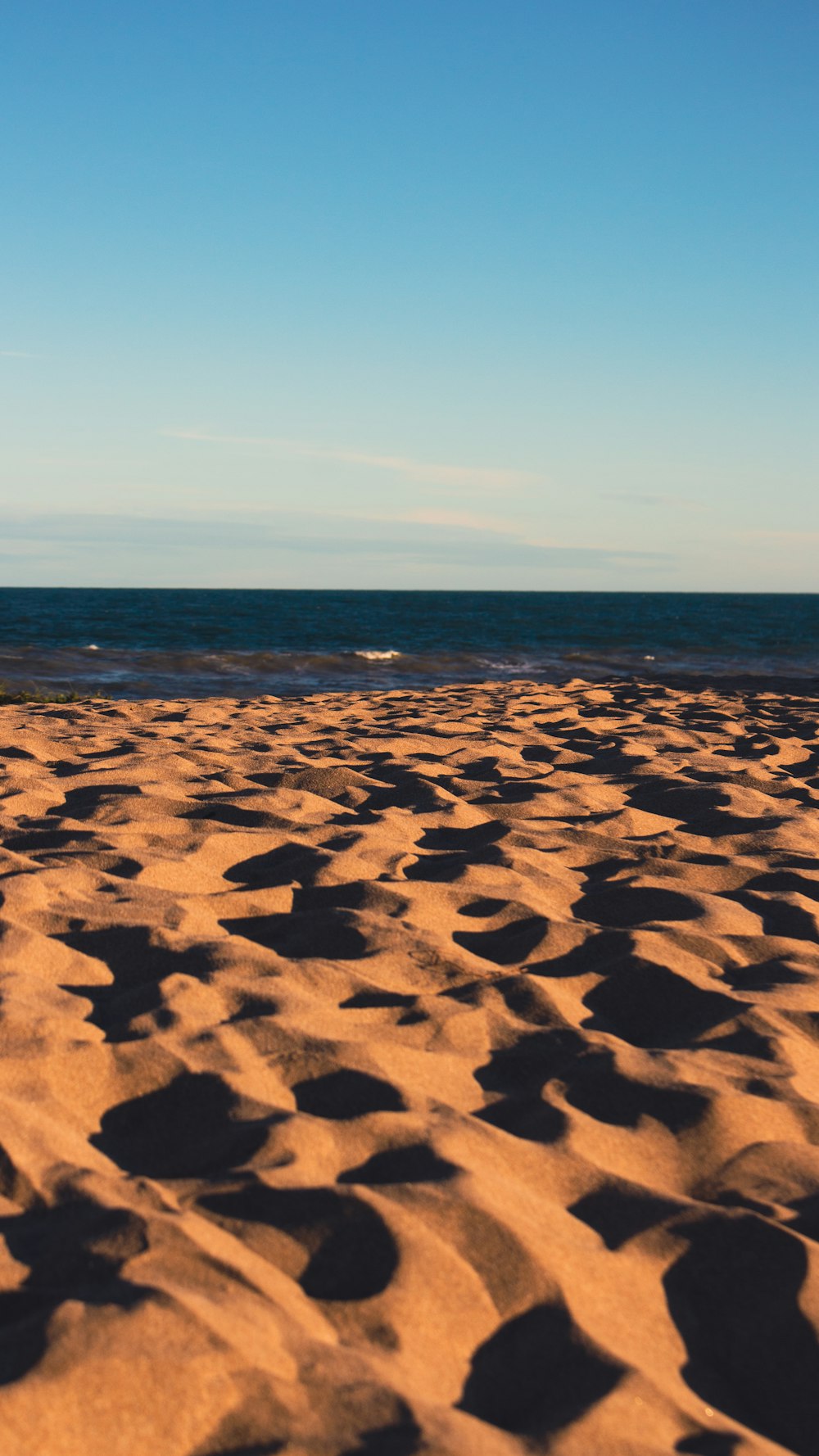 a view of the beach from the sand