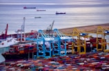 A busy Dubai port with containers being loaded, symbolizing global trade.