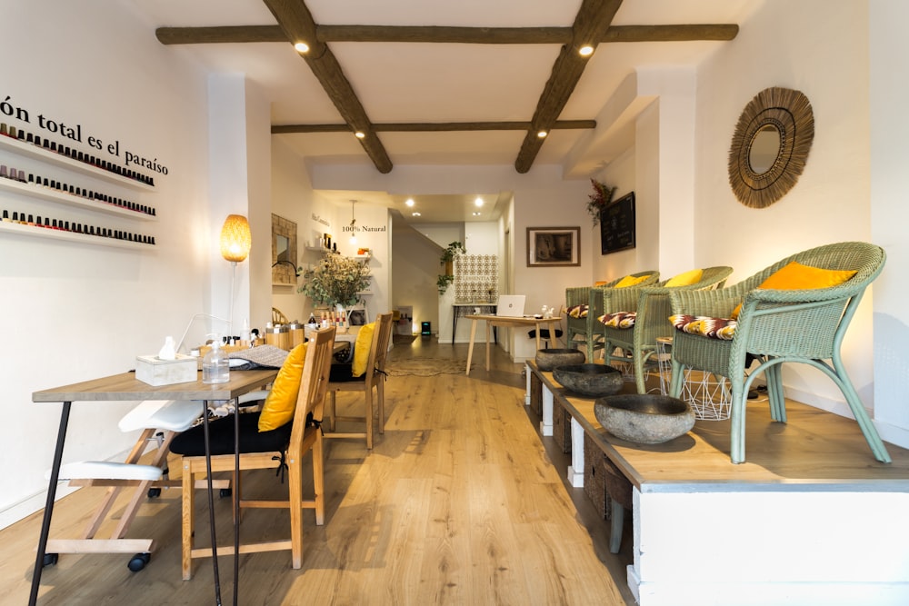 a restaurant with wooden floors and white walls