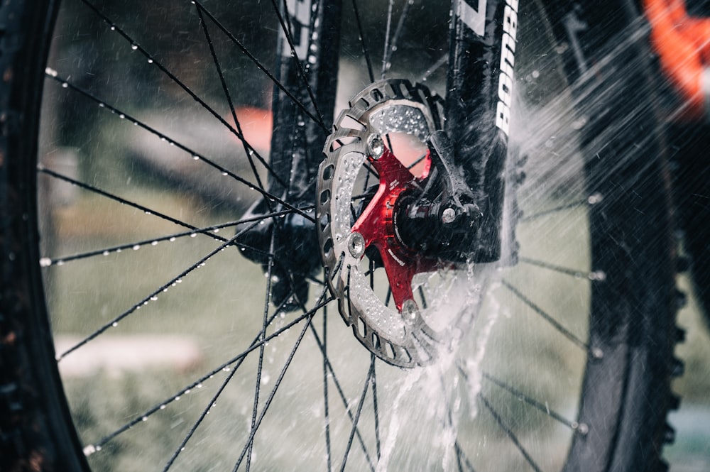 a close up of a bike tire with water on it