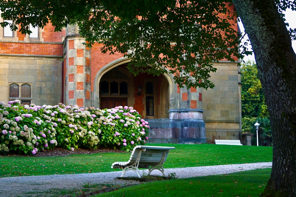 a bench in front of a large building