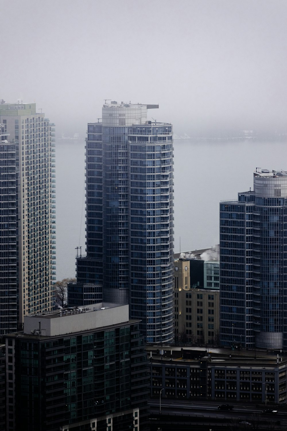 a view of some very tall buildings in a big city