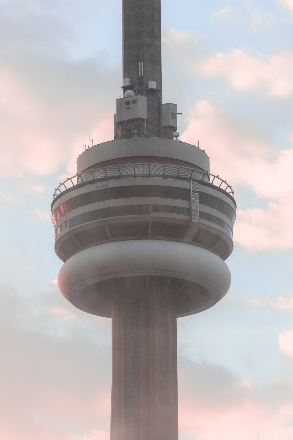 a very tall tower with a clock on it's side