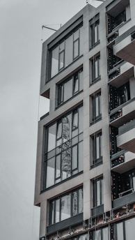 Sleek commercial building exterior with large glass windows and minimalist architectural details