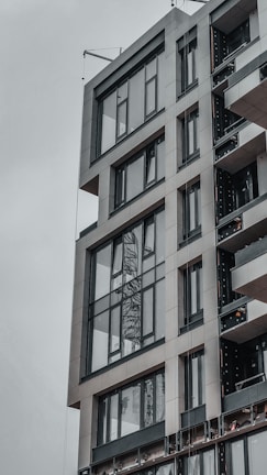 Modern commercial building featuring charcoal accents and expansive glass surfaces.