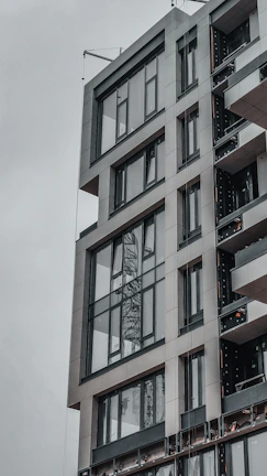 Modern architectural building with sleek gray and black exterior design.
