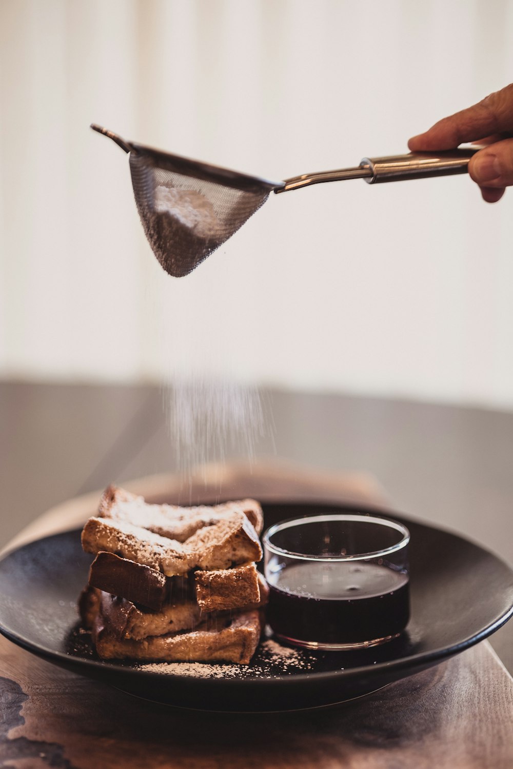 a plate with some food on it and a spoon sticking out of it