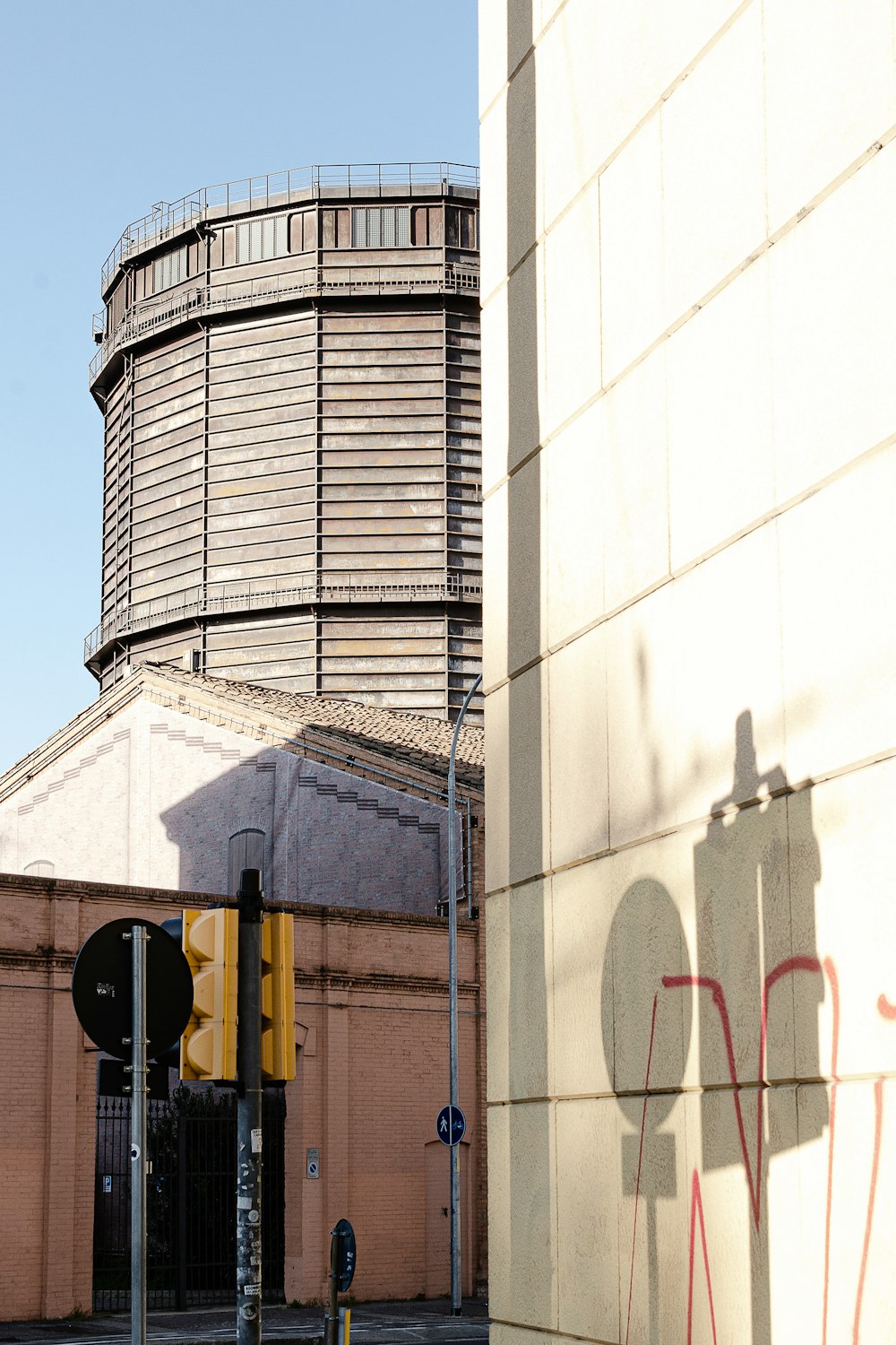 a building with a large round window next to a traffic light