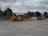 A technician inspecting heavy machinery in a construction site.