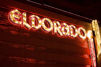 a close up of a neon sign on a building