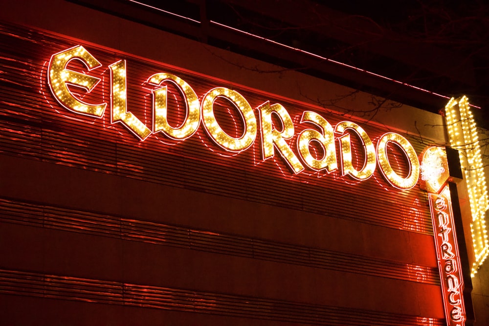 a close up of a neon sign on a building