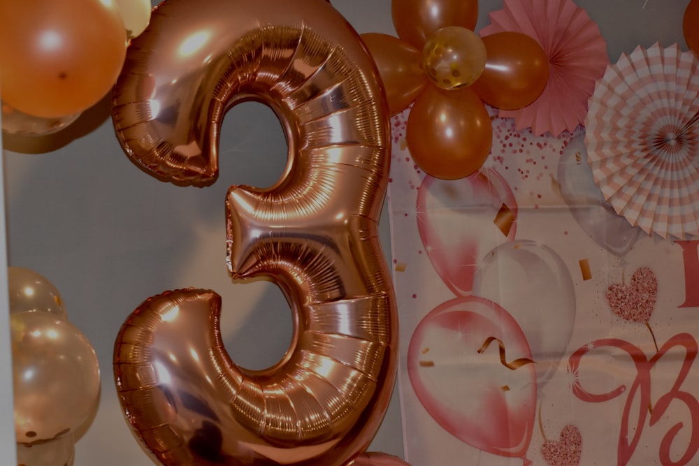 a large number five balloon sitting on top of a table