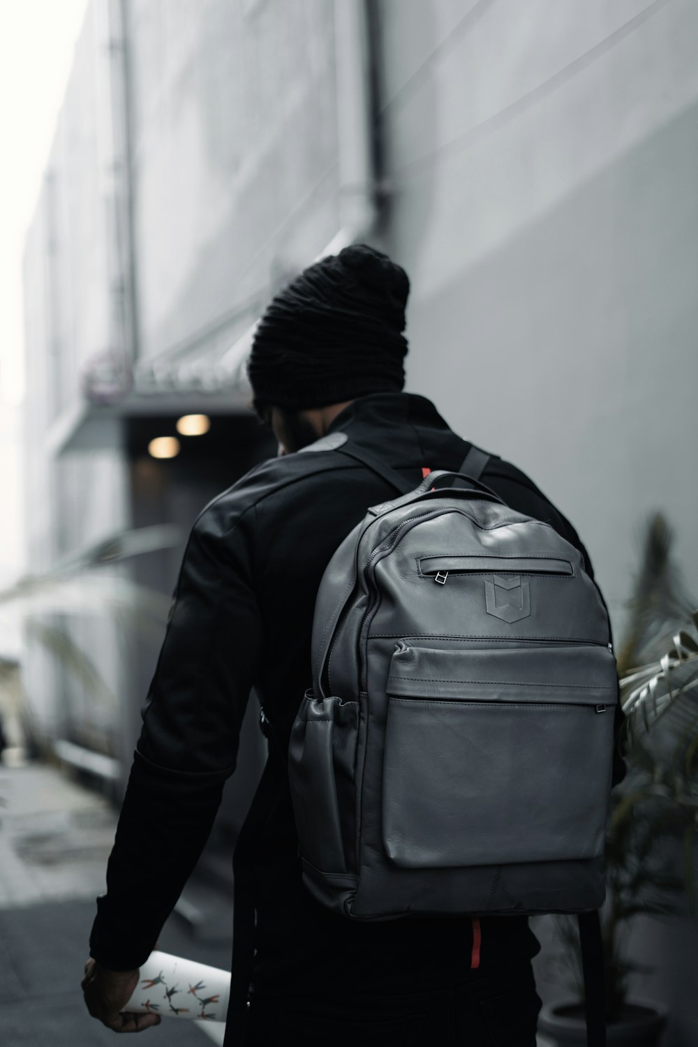 a man in a turban walks down the street