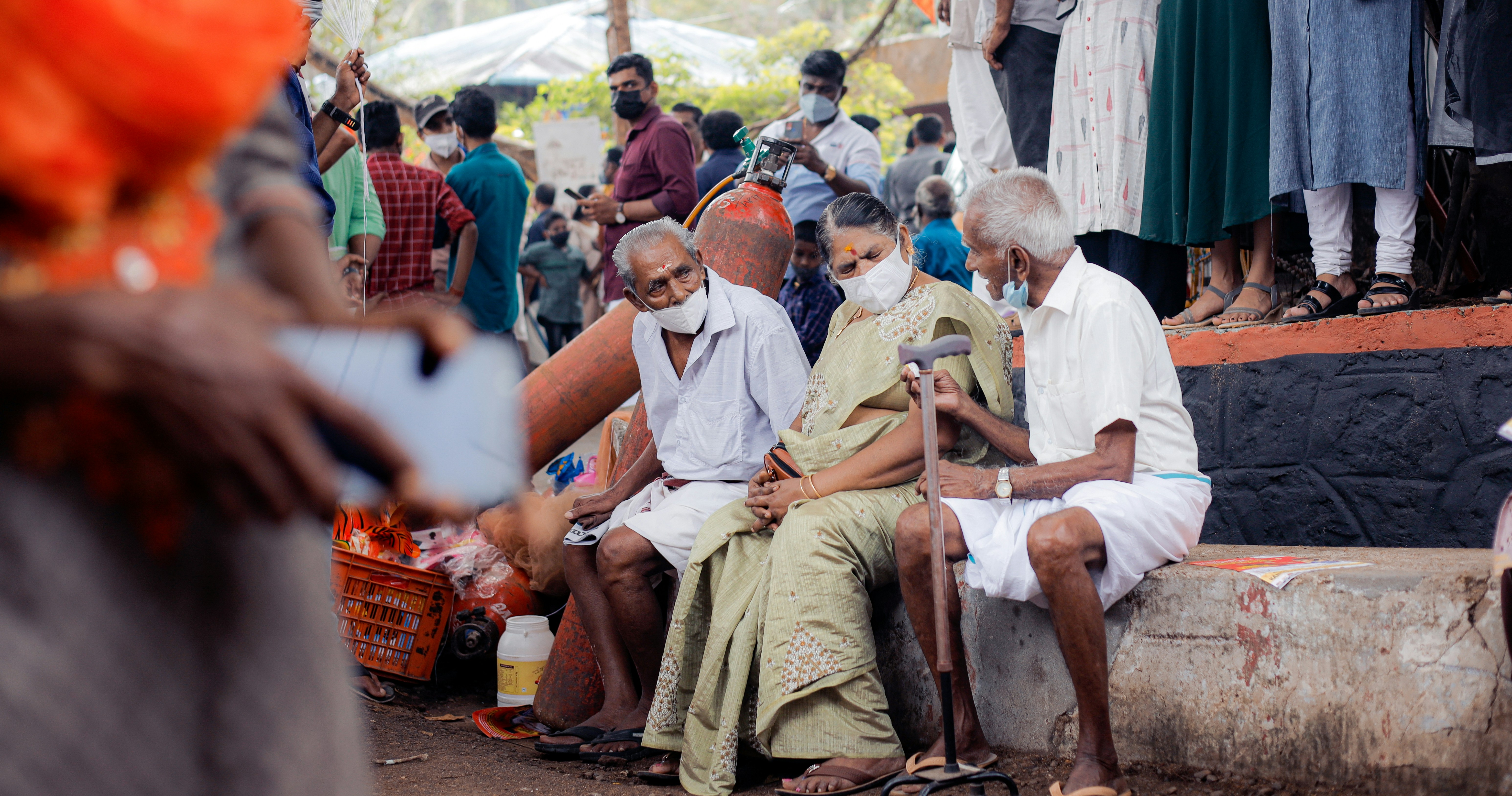 a group of people sitting next to each other