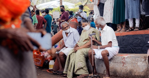 a group of people sitting next to each other
