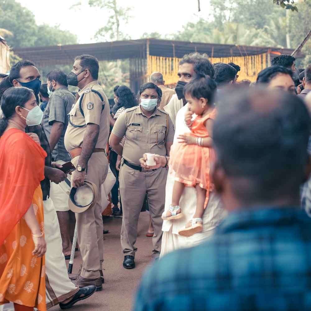 a group of people standing around each other