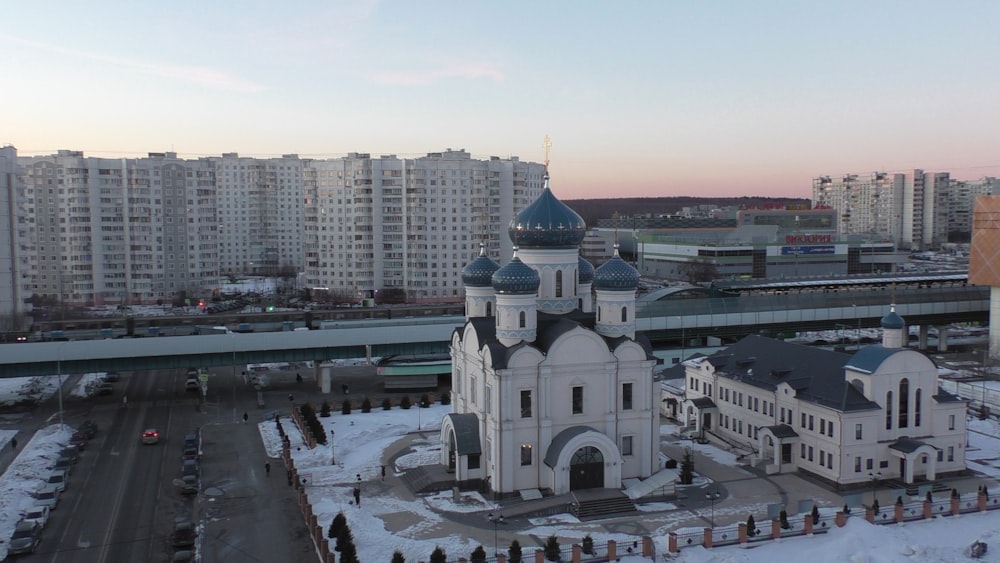 an aerial view of a church in a city