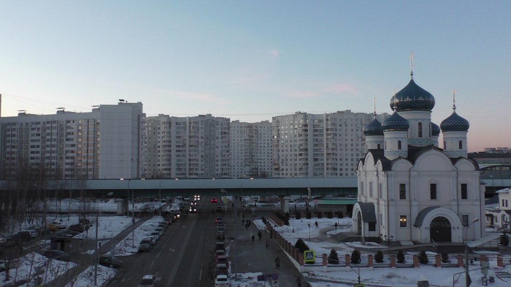 a large white building with a clock tower