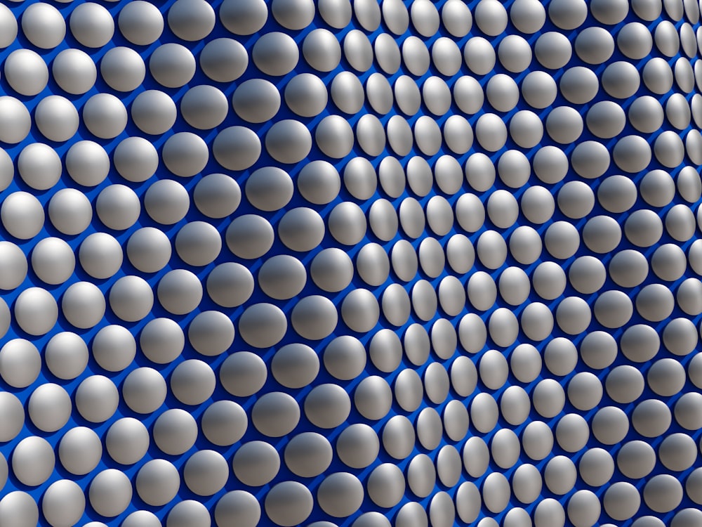 a blue and white wall with a lot of circles on it