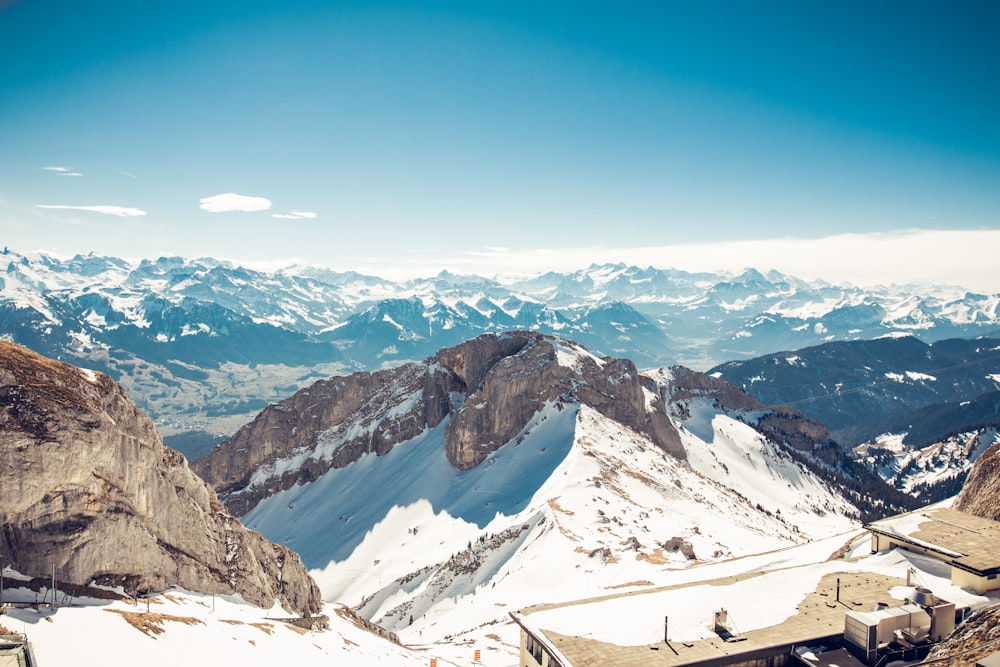 a mountain range with snow covered mountains in the background