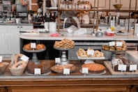a bakery counter filled with lots of pastries